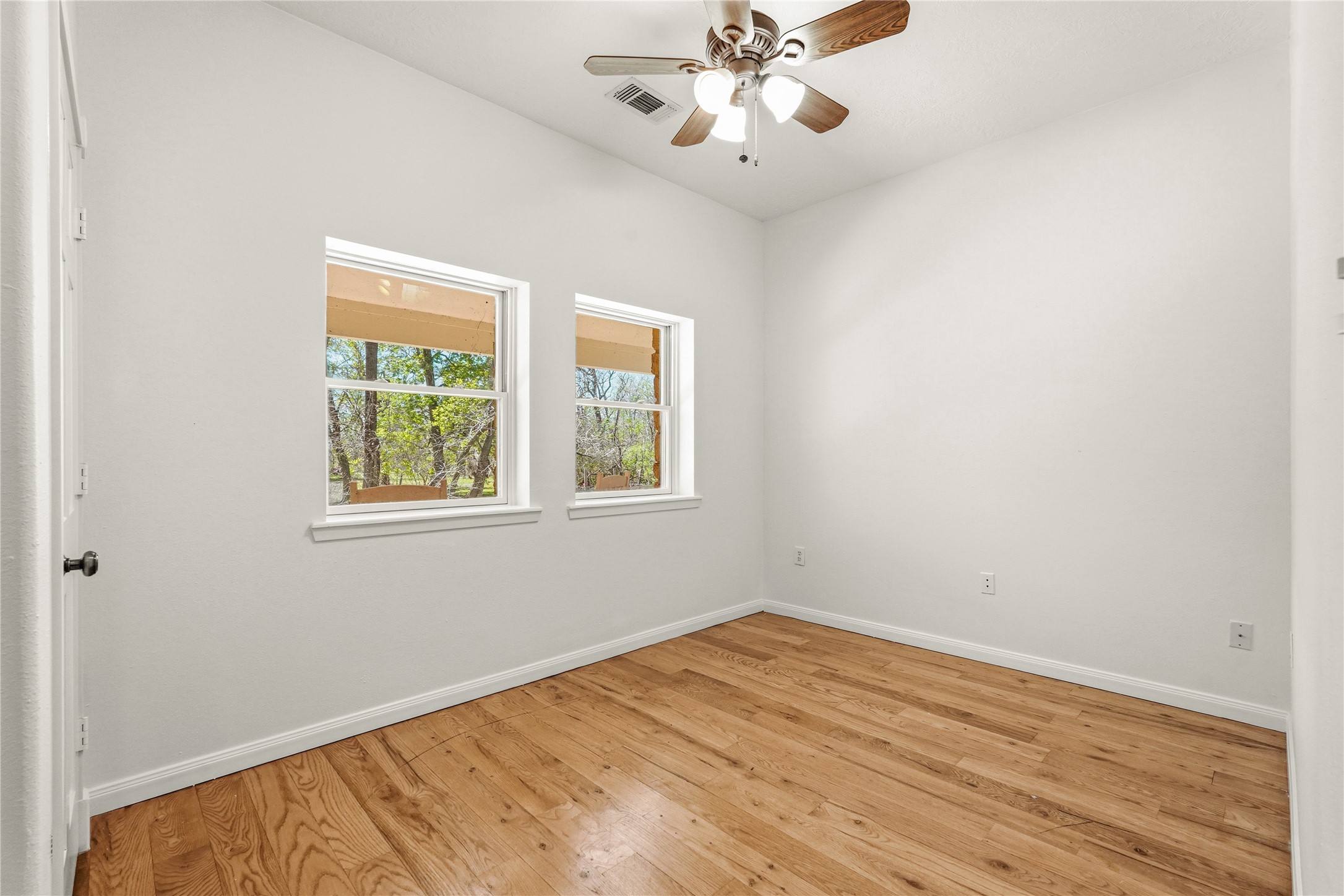 41712 Harpers Church Road Hempstead, TX 77445 - Photo 33 of 50 Bedroom off of Primary, wooden flooring and treed views