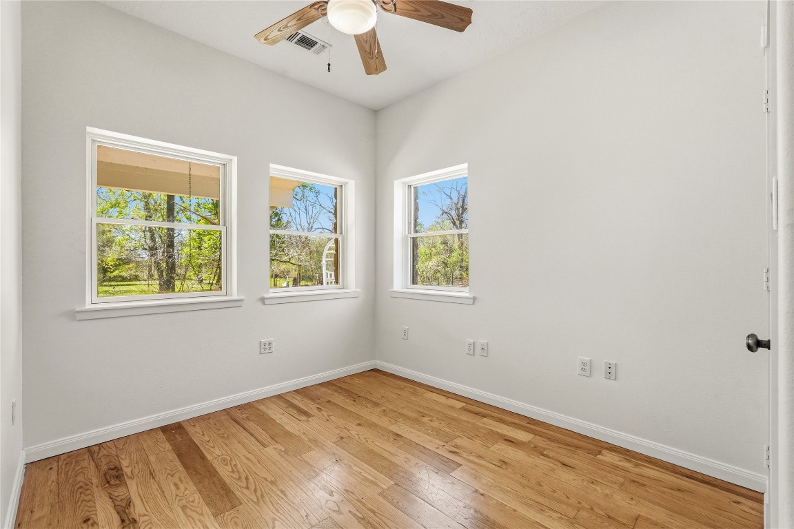 41712 Harpers Church Road Hempstead, TX 77445 - Photo 35 of 50 Flex/Bedroom,nursery,work out room by Primary. Tree views and wooden flooring
