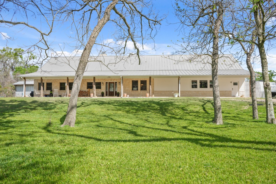41712 Harpers Church Road Hempstead, TX 77445 - Photo 4 of 50 Front view w 10x60 porch, cedar post, variety of trees