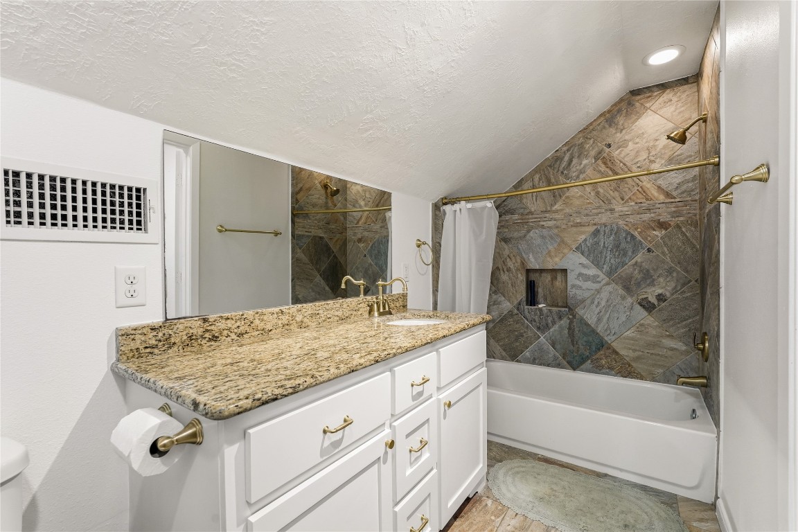 41712 Harpers Church Road Hempstead, TX 77445 - Photo 42 of 50 a bathroom with a granite countertop sink and a bathtub