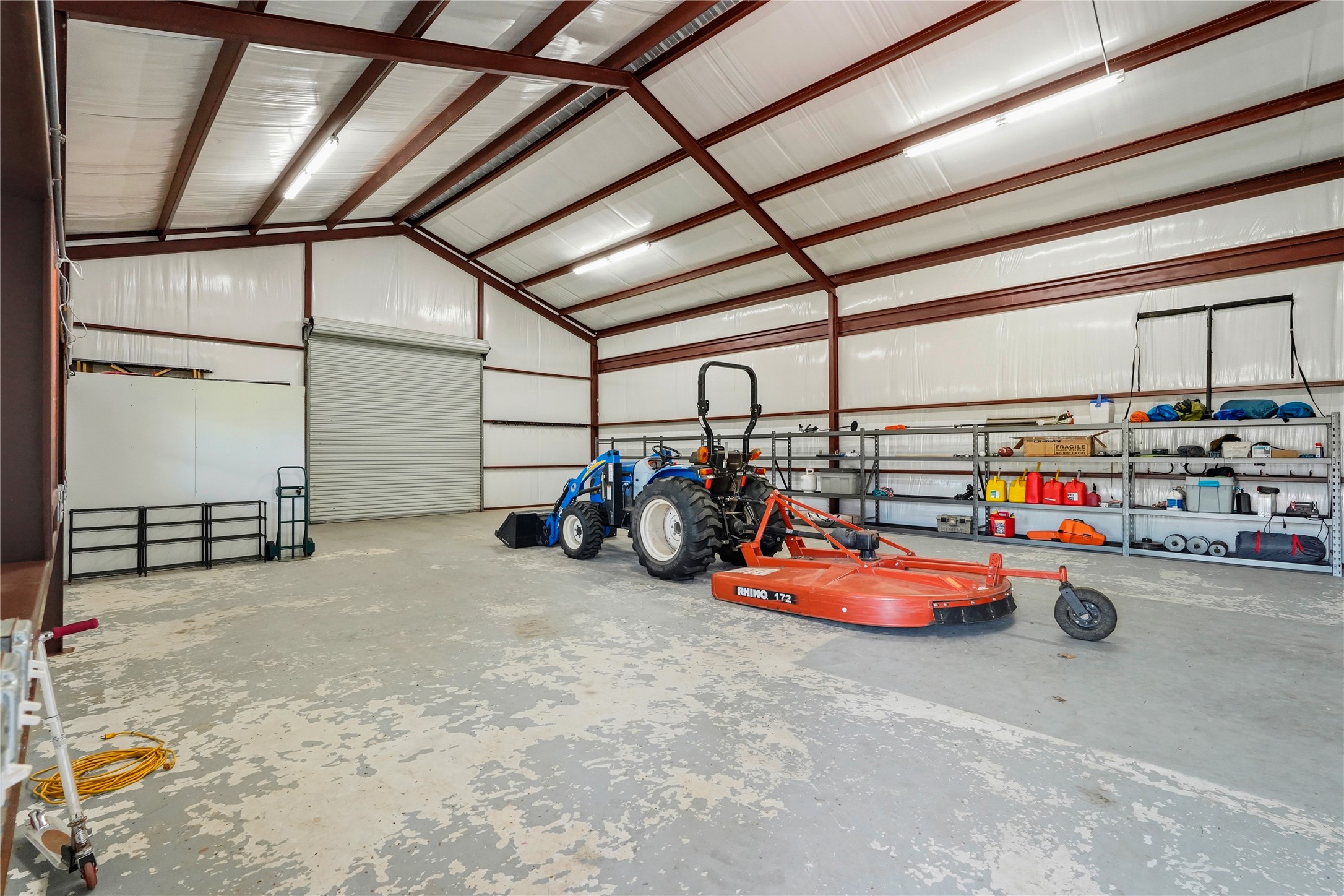 41712 Harpers Church Road Hempstead, TX 77445 - Photo 46 of 50 Insulated Barn and storage galore, 2 - 12 ft roll doors, Industrial shelving to hold 10k pounds