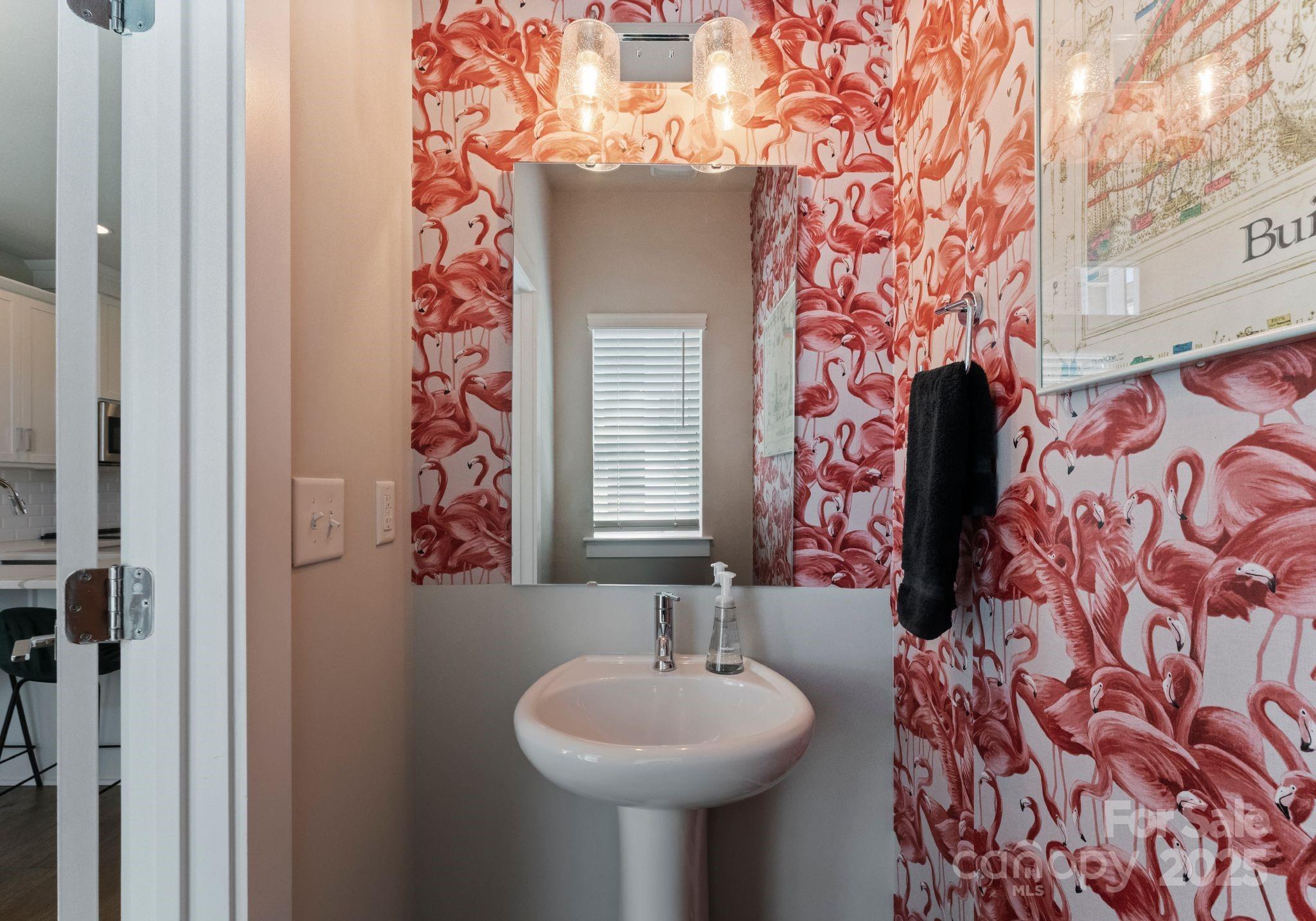 2111 Isom Street Charlotte, NC 28208 - Photo 15 of 36 a bathroom with a sink and mirror with bathtub