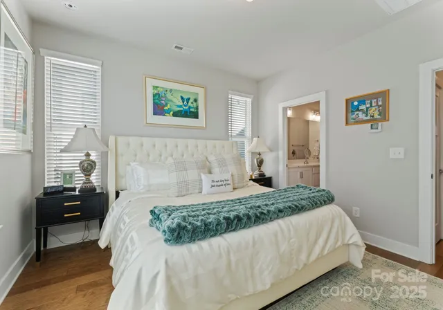 a bedroom with a bed and a couch