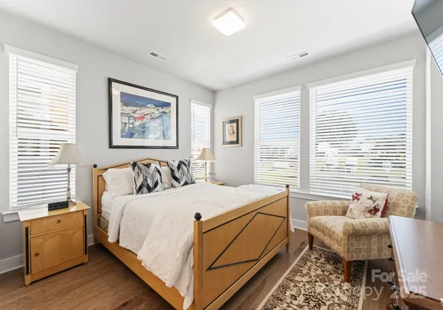 a bedroom with a bed and a couch