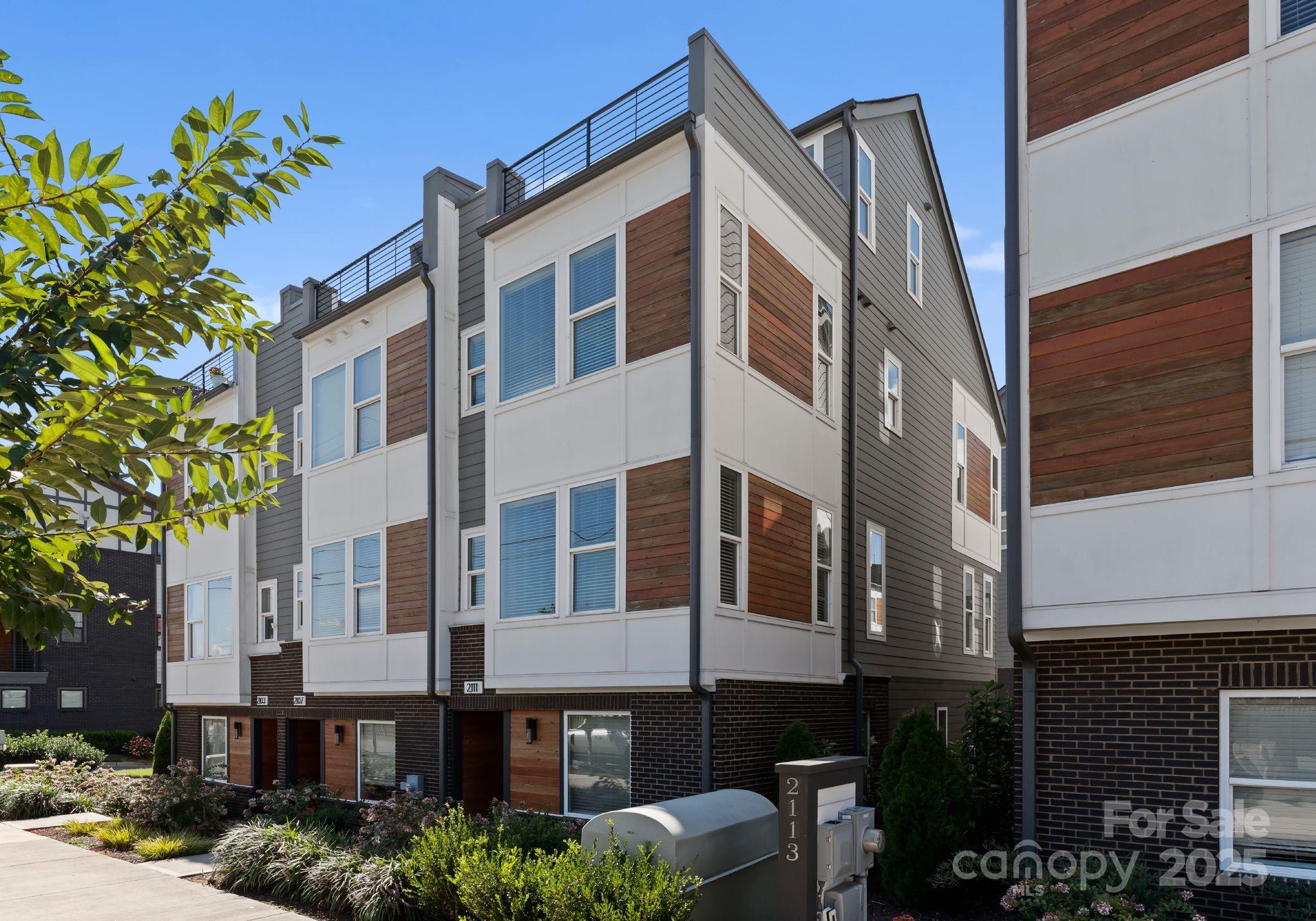 2111 Isom Street Charlotte, NC 28208 - Photo 3 of 36 a front view of a building with balcony