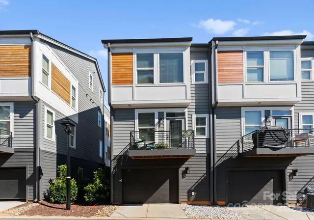 a front view of a building with many windows