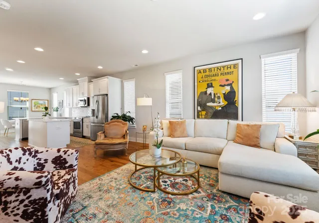 a living room with furniture and a table