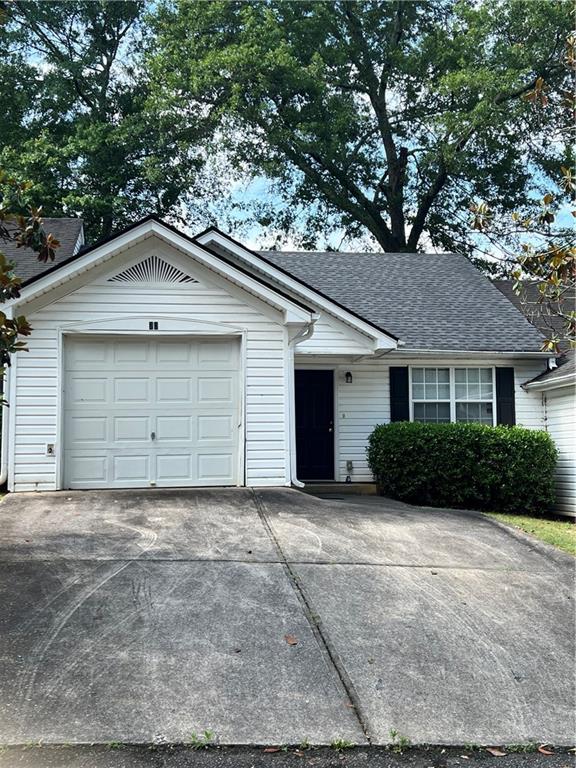 a front view of a house with a garage