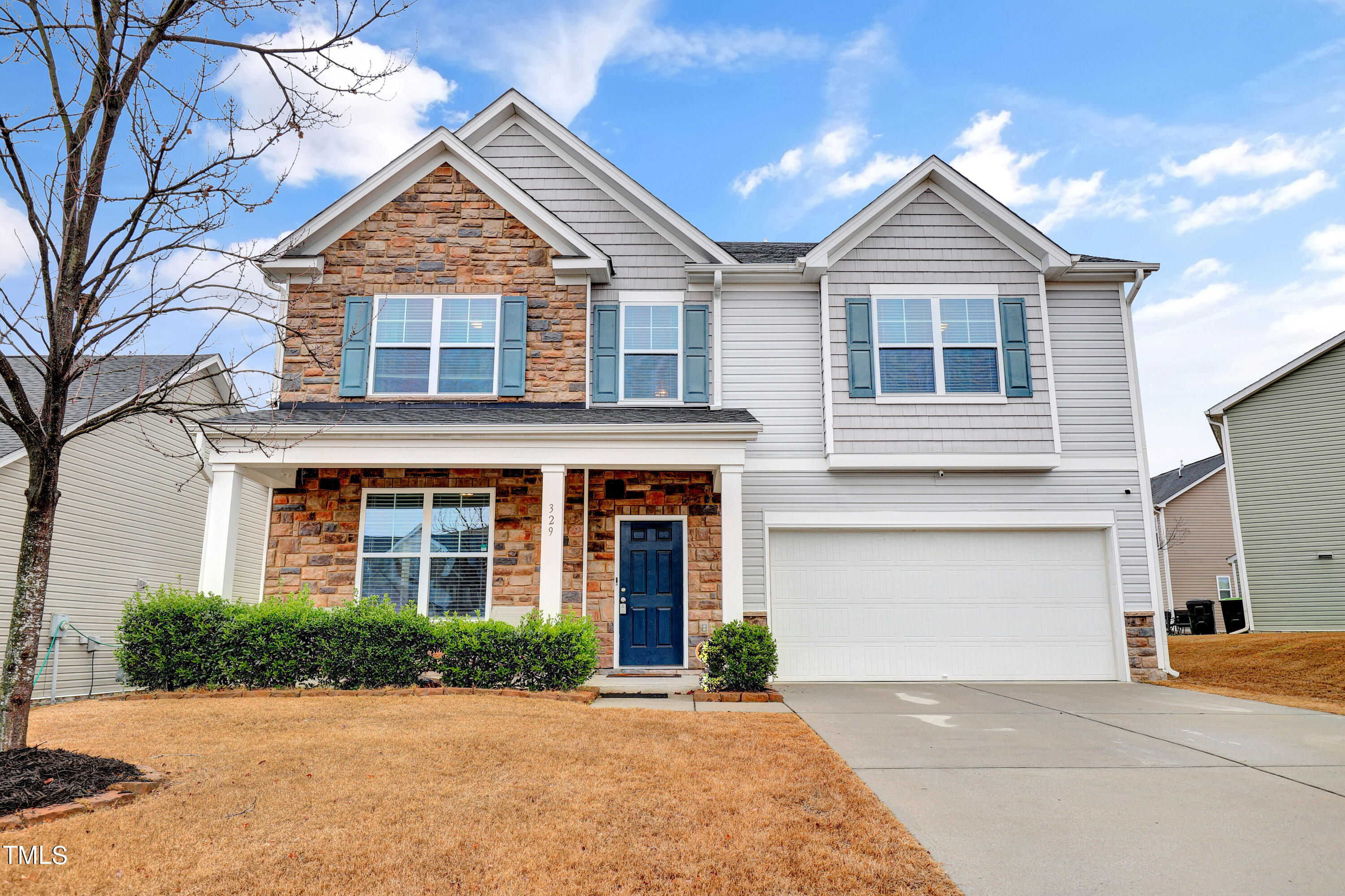329 Hope Valley Road Knightdale, NC 27545 - Photo 1 of 34 front view of a house with a yard