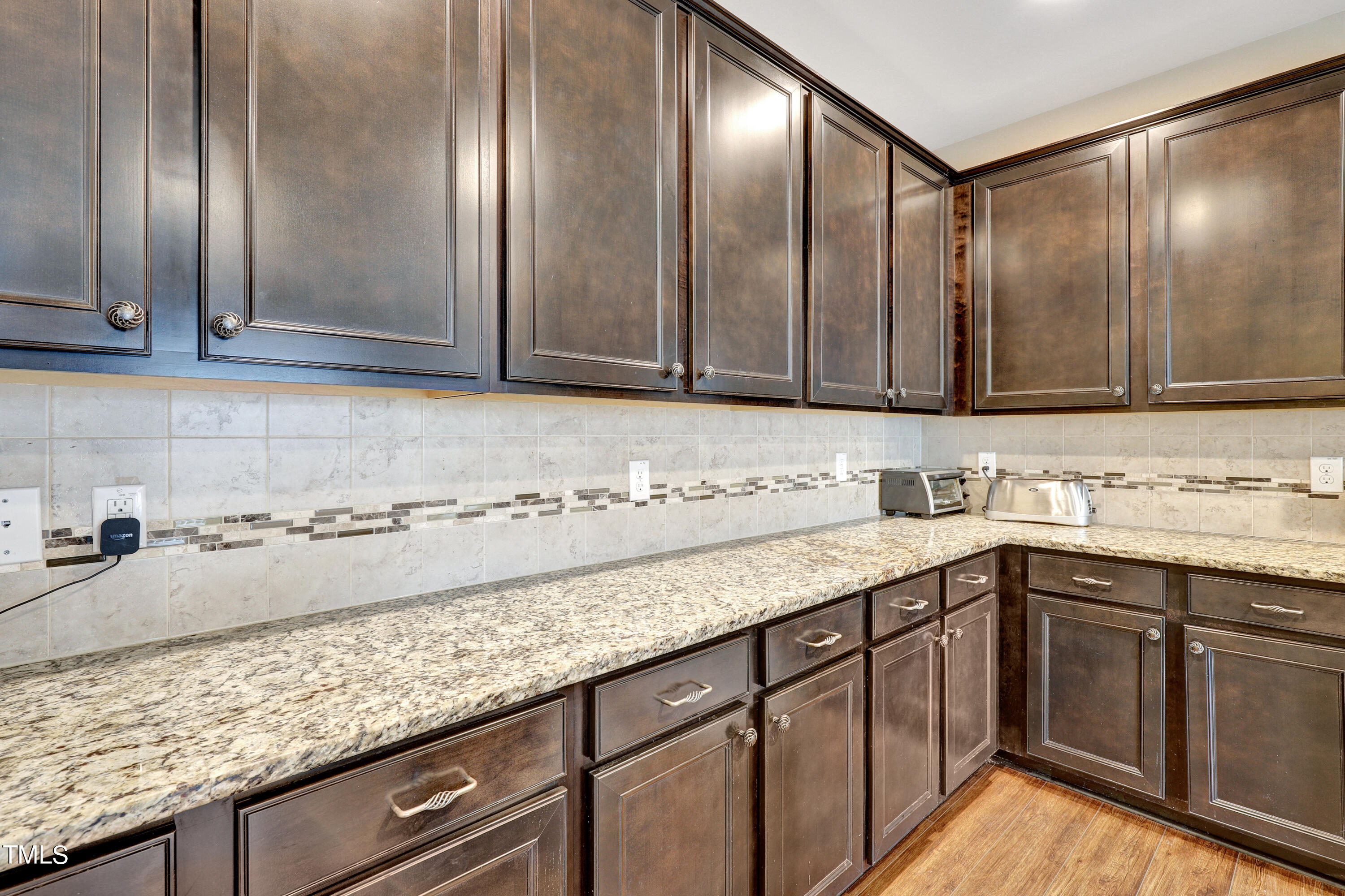 329 Hope Valley Road Knightdale, NC 27545 - Photo 11 of 34 a kitchen with granite countertop stainless steel appliances sink and cabinets