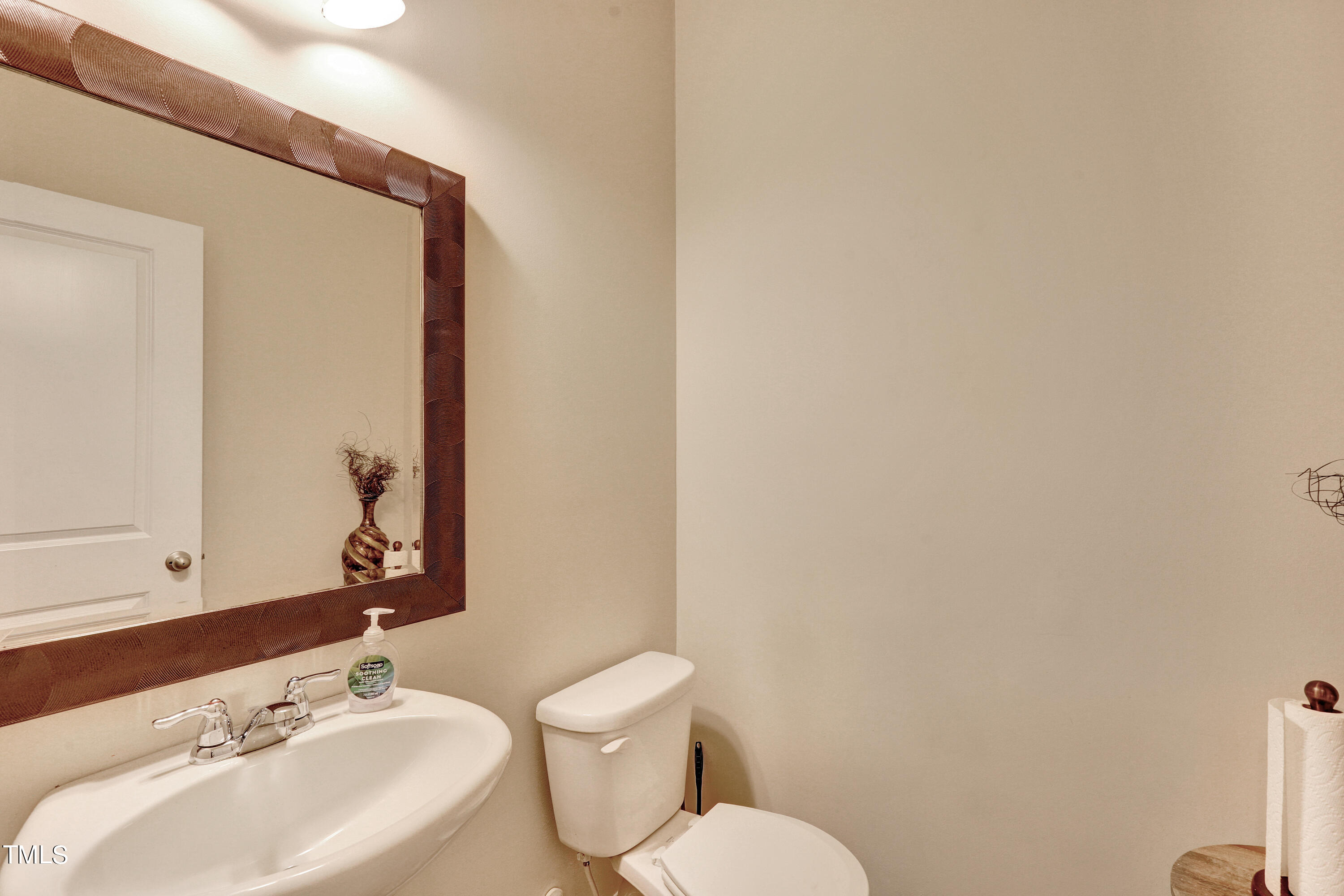329 Hope Valley Road Knightdale, NC 27545 - Photo 14 of 34 a bathroom with a sink mirror and toilet