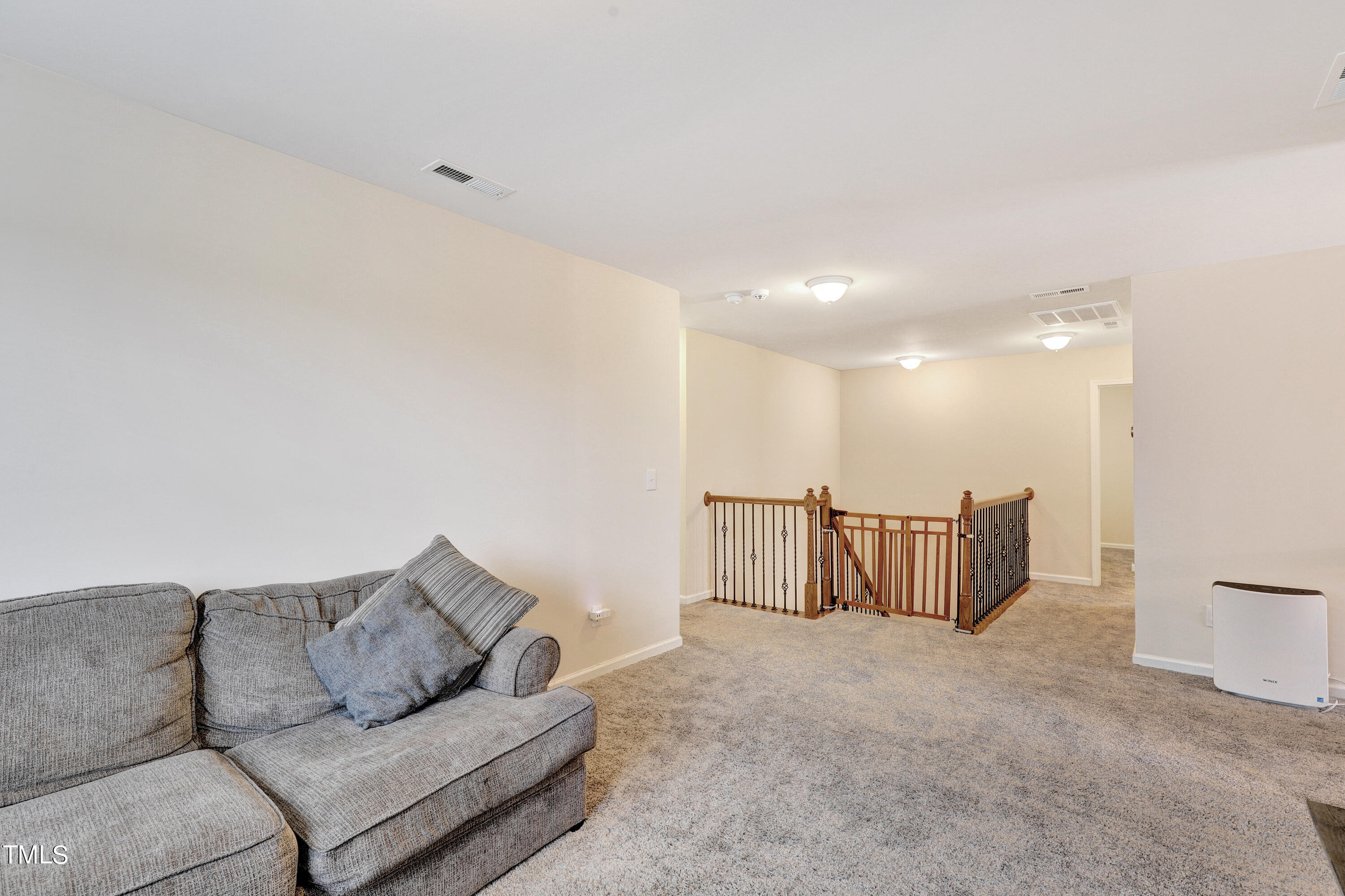 329 Hope Valley Road Knightdale, NC 27545 - Photo 17 of 34 a living room with furniture and a couch