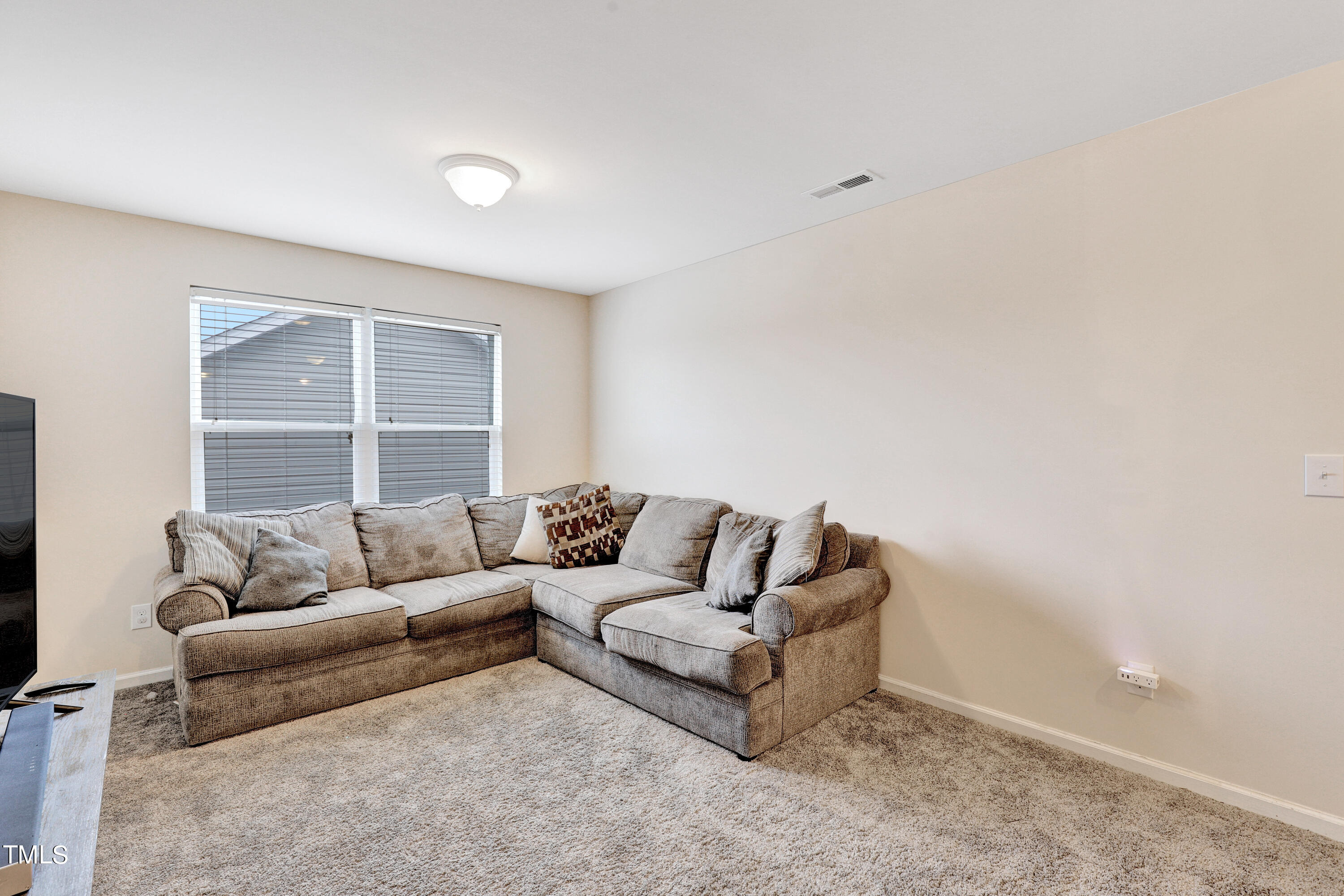 329 Hope Valley Road Knightdale, NC 27545 - Photo 18 of 34 a living room with furniture and a window