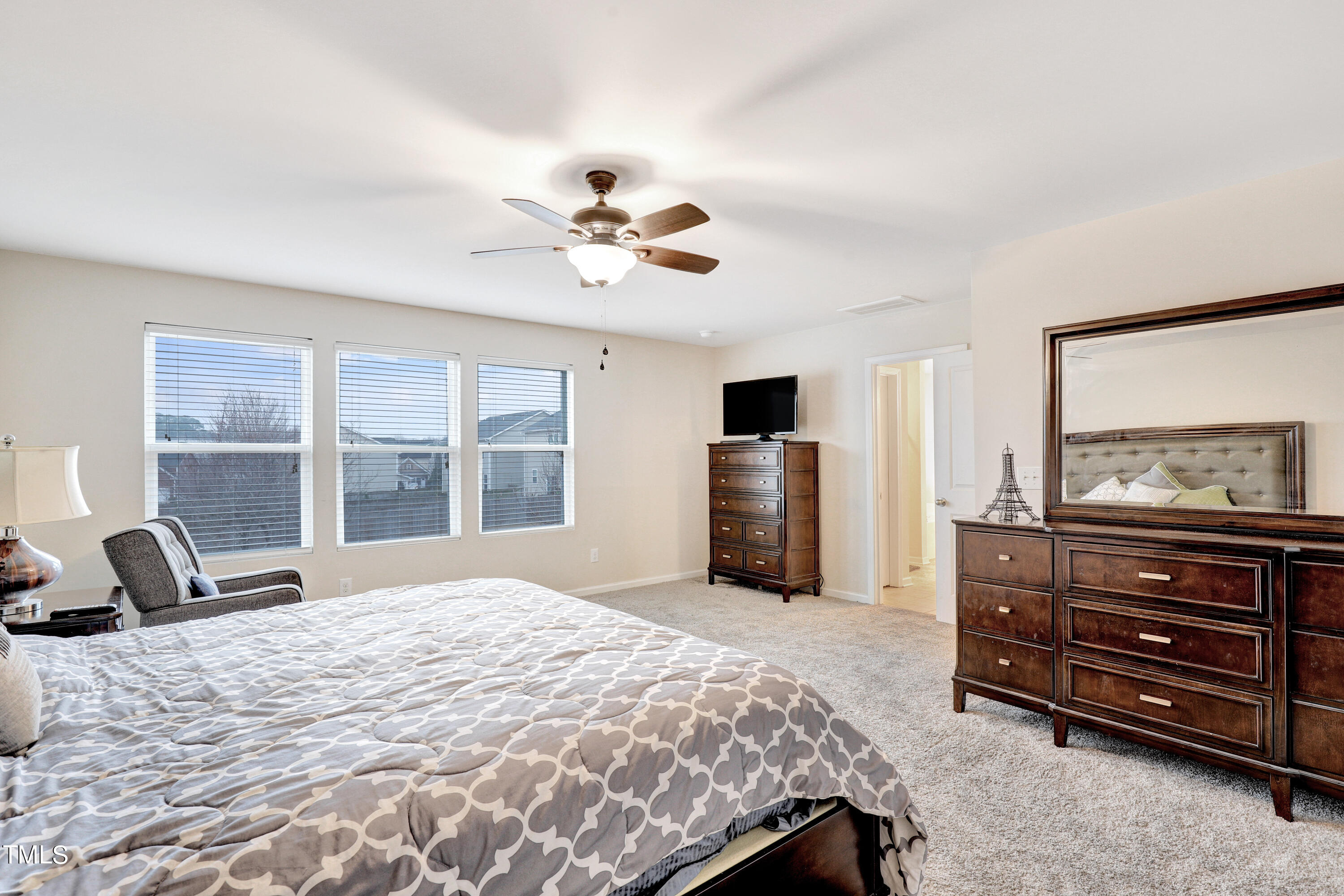 329 Hope Valley Road Knightdale, NC 27545 - Photo 21 of 34 a bedroom with a bed and wooden floor