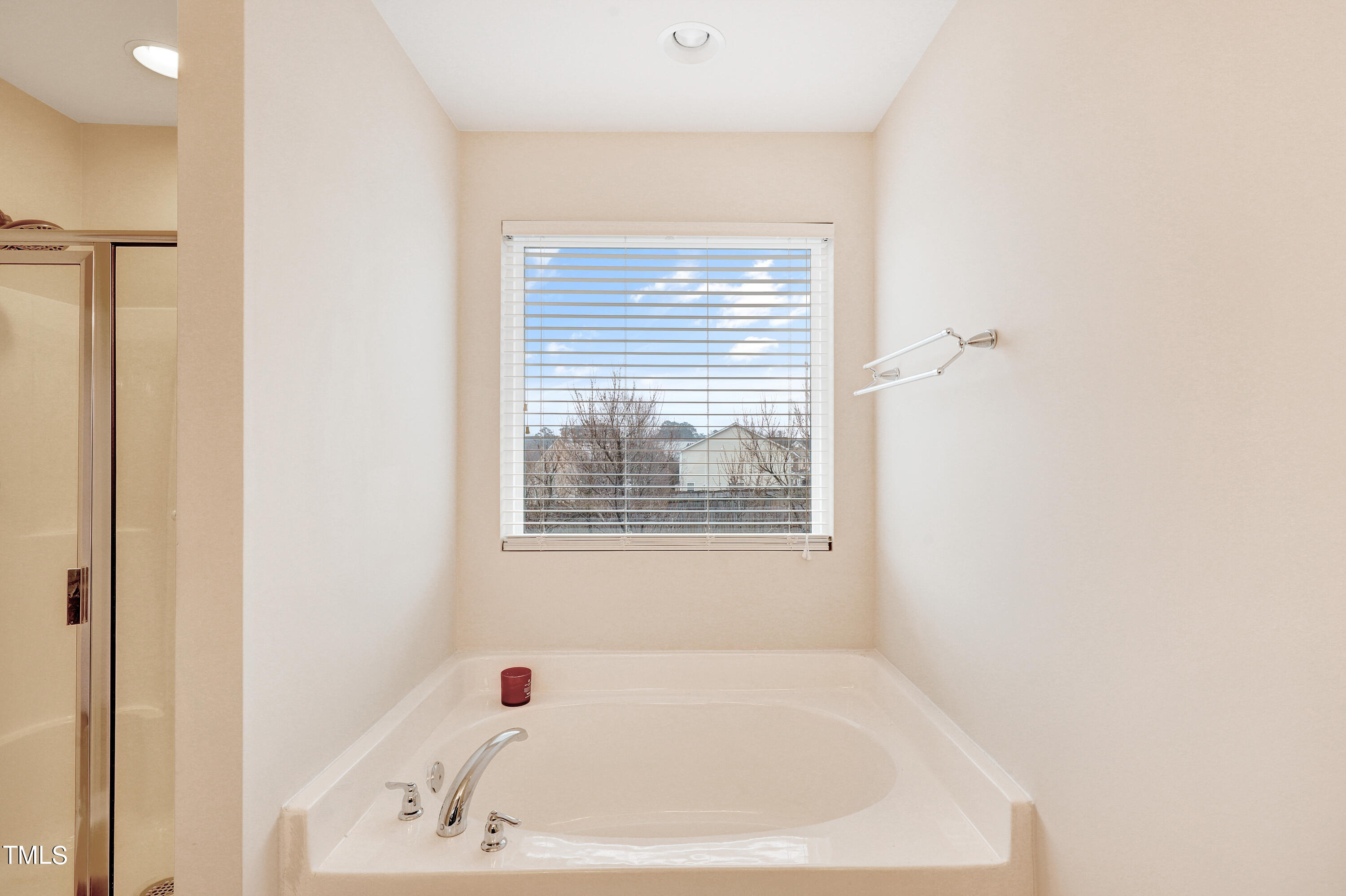 329 Hope Valley Road Knightdale, NC 27545 - Photo 23 of 34 a white bath tub sitting next to a window