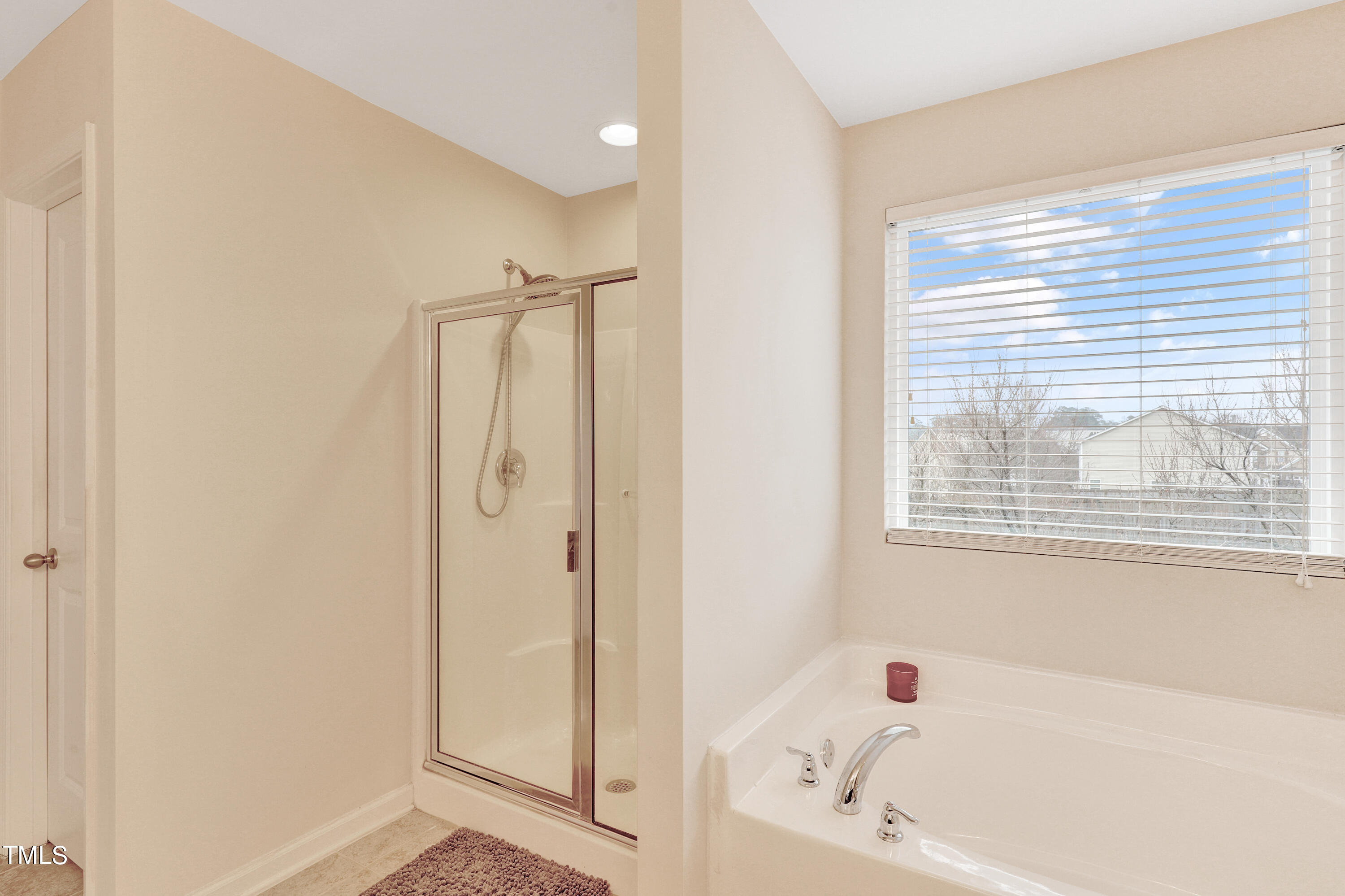 329 Hope Valley Road Knightdale, NC 27545 - Photo 24 of 34 a bathroom with a bathtub and a shower