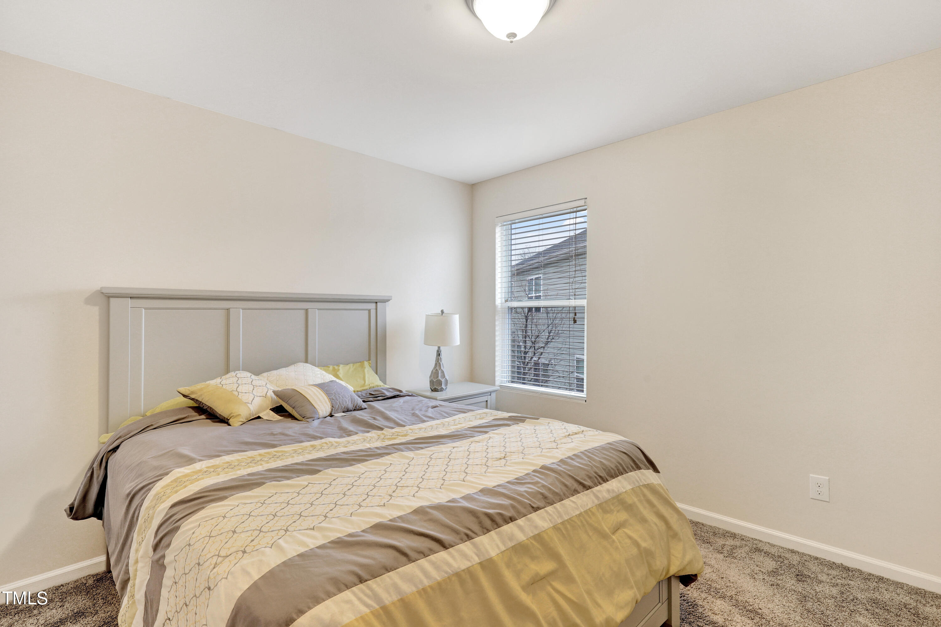 329 Hope Valley Road Knightdale, NC 27545 - Photo 29 of 34 a bedroom with a bed and a window