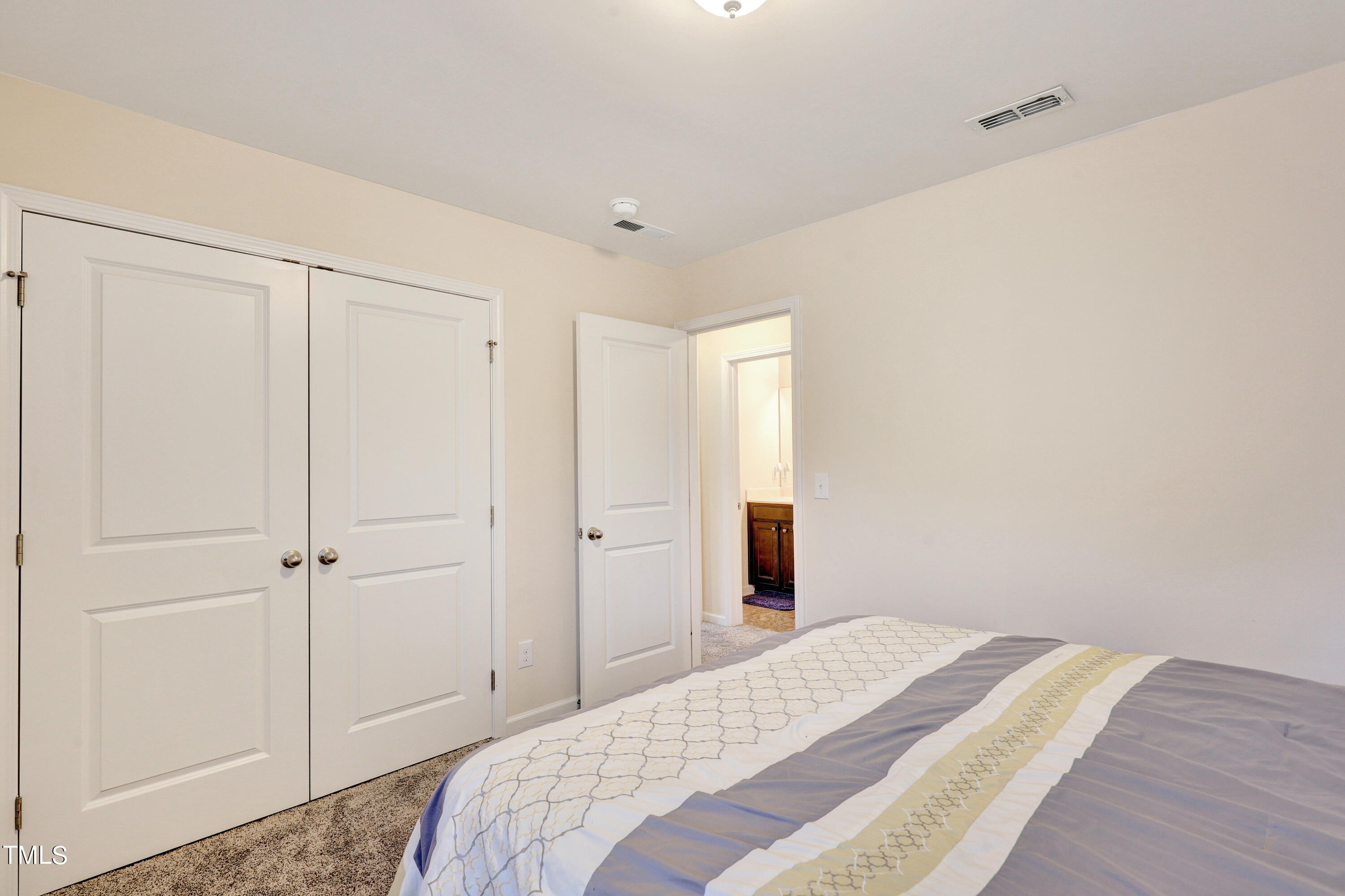329 Hope Valley Road Knightdale, NC 27545 - Photo 30 of 34 a bedroom with a bed and a closet