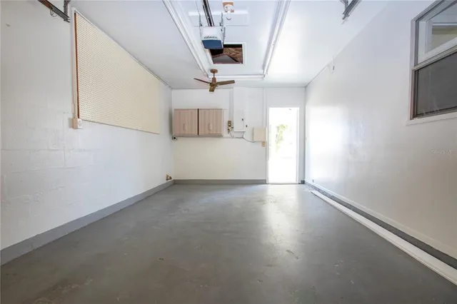 a room with furniture pool table and wooden floor