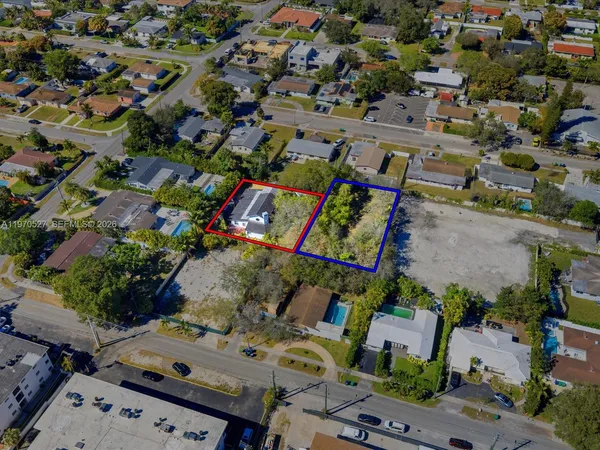 an aerial view of a houses with outdoor space