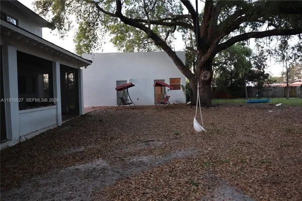 a backyard of a house with lots of green space