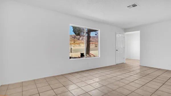a view of an empty room and window