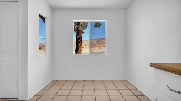 a view of an empty room and window