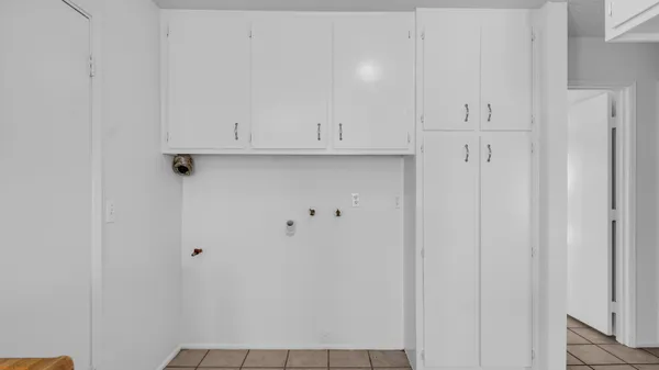 a kitchen with granite countertop a sink and a stove