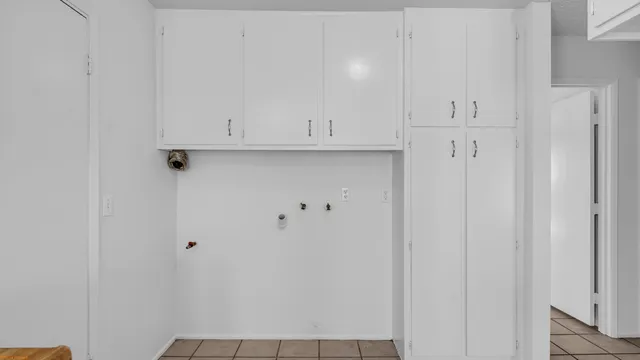 a kitchen with granite countertop a sink and a stove