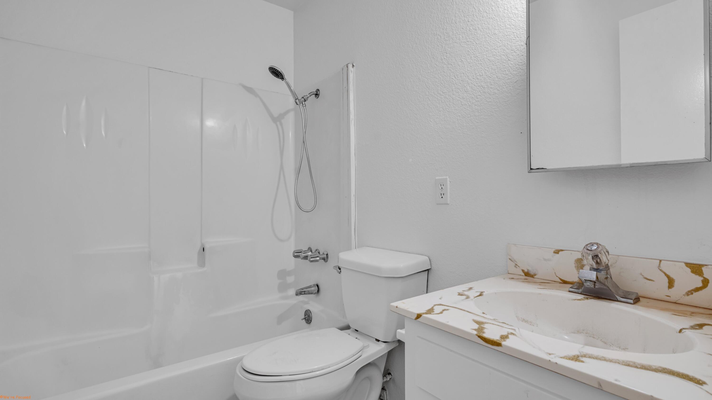 67285 Pierson Boulevard, Unit B Desert Hot Springs, CA 92240 - Photo 23 of 29 a bathroom with a sink toilet and shower