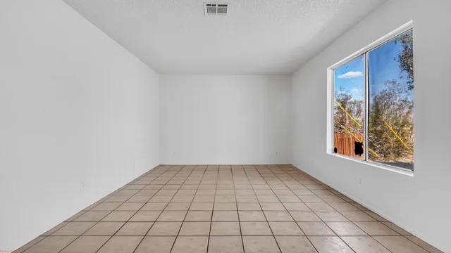 a view of an empty room and window