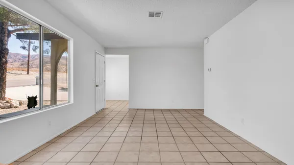 a view of an empty room and window