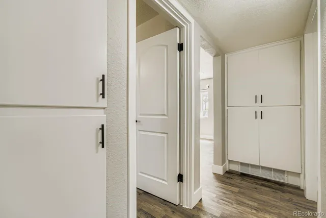 a view of a bathroom with wooden floor