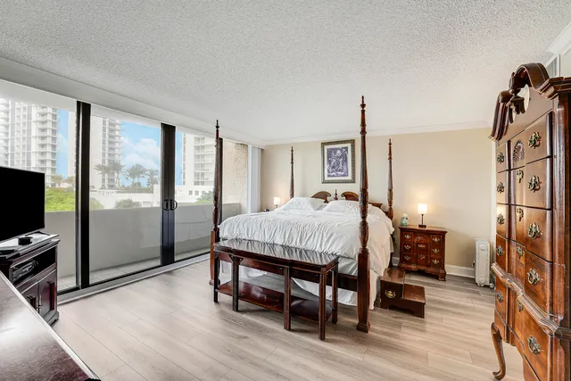 a bed room with a bed and a tv