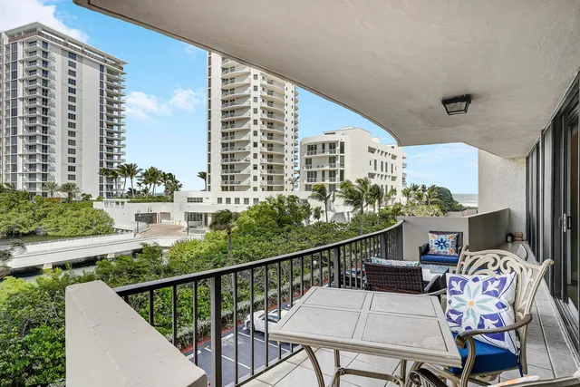 a balcony view with couple of chairs