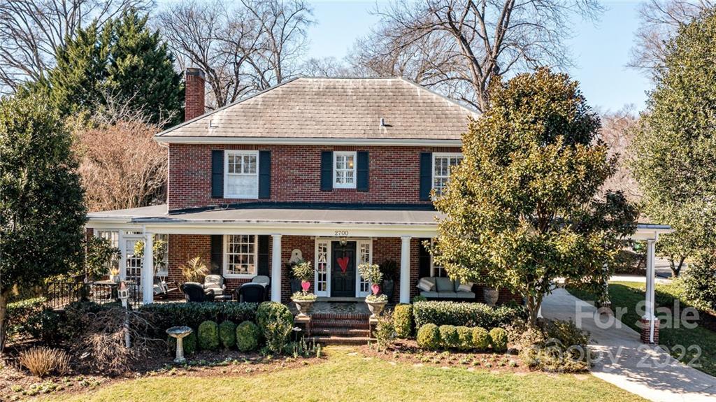 a front view of house with yard outdoor seating and barbeque oven