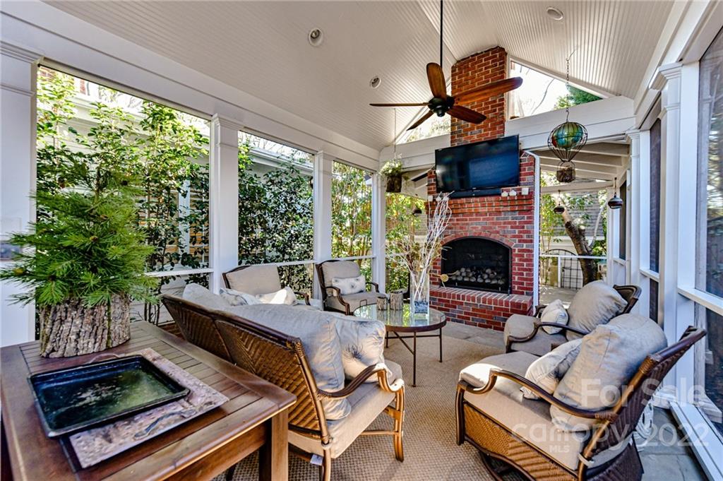 2700 Normandy Road Charlotte, NC 28209 - Photo 19 of 42 a living room with furniture a fireplace and a potted plant