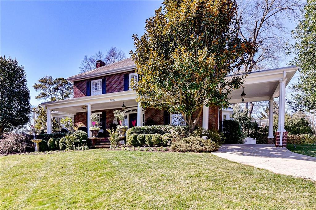 2700 Normandy Road Charlotte, NC 28209 - Photo 2 of 42 a front view of a house with yard and dining space