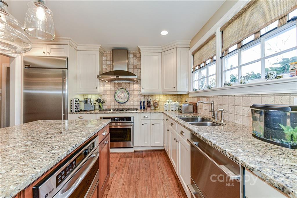 2700 Normandy Road Charlotte, NC 28209 - Photo 21 of 42 a kitchen with a stove sink and refrigerator