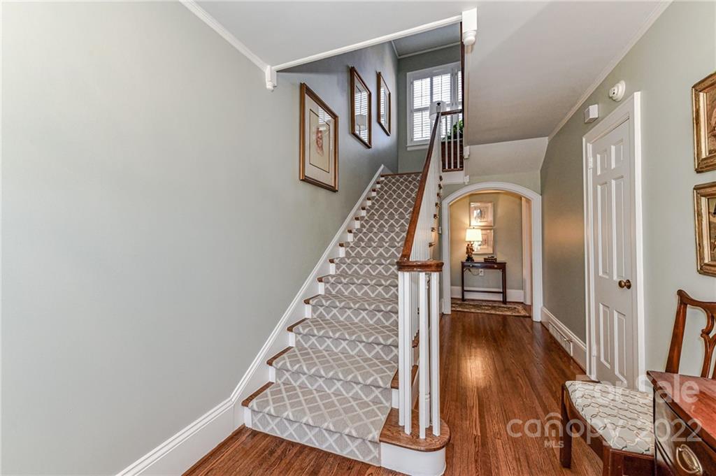2700 Normandy Road Charlotte, NC 28209 - Photo 28 of 42 a view of staircase with wooden floor and a rug