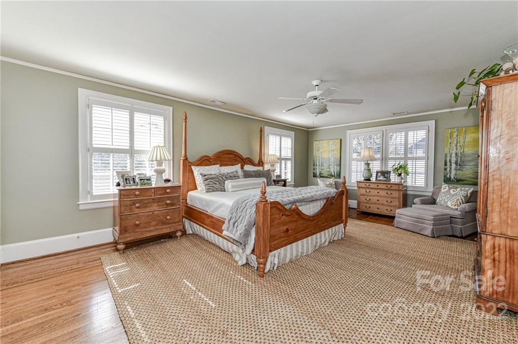2700 Normandy Road Charlotte, NC 28209 - Photo 29 of 42 a bedroom with a large bed and a couch