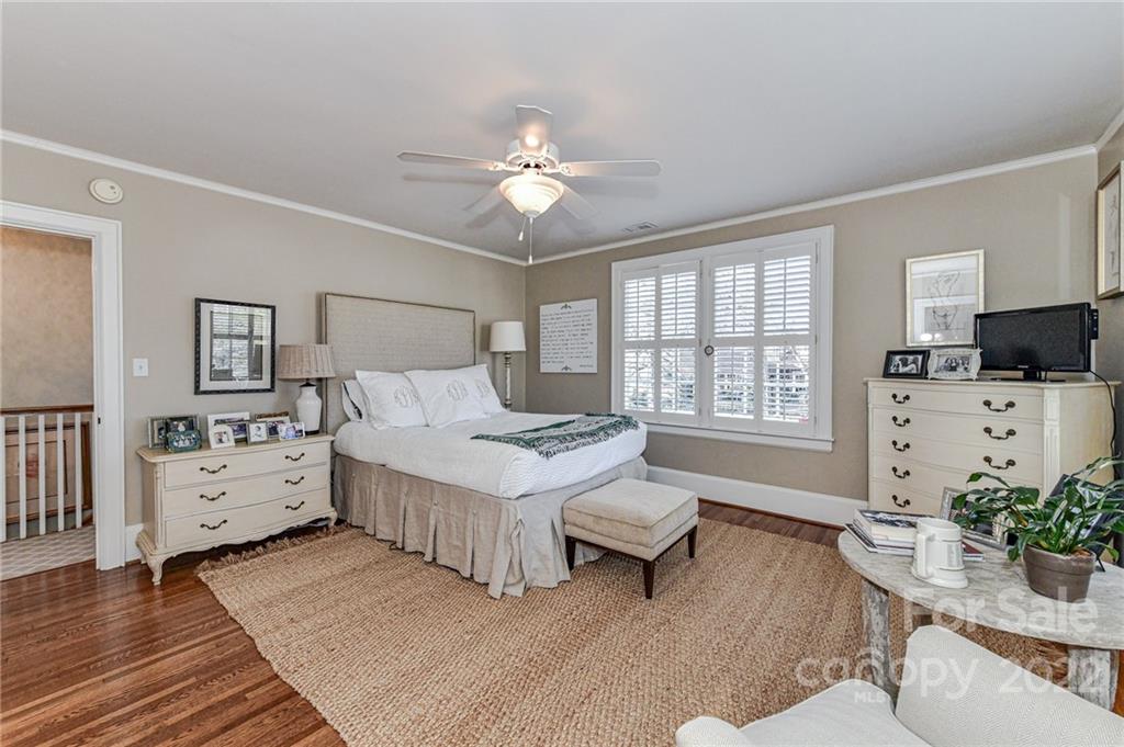 2700 Normandy Road Charlotte, NC 28209 - Photo 33 of 42 a spacious bedroom with a bed and a dresser