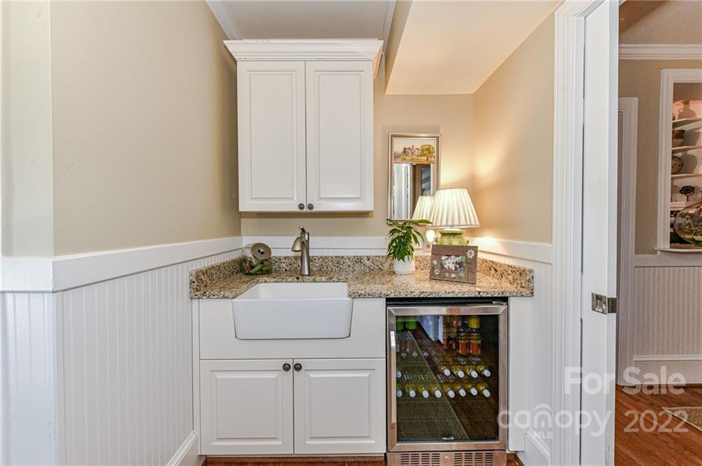 2700 Normandy Road Charlotte, NC 28209 - Photo 37 of 42 a kitchen with granite countertop a sink cabinets and stainless steel appliances