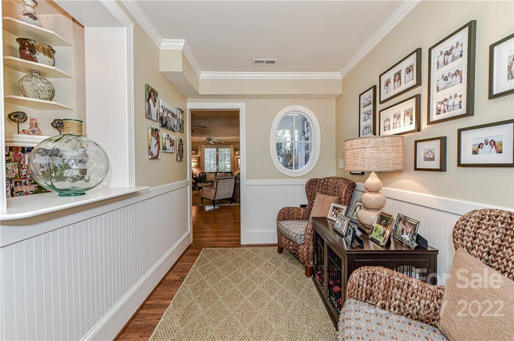 2700 Normandy Road Charlotte, NC 28209 - Photo 40 of 42 a living room with furniture and paintings on the wall