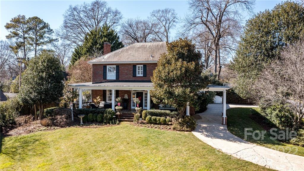 2700 Normandy Road Charlotte, NC 28209 - Photo 41 of 42 a view of house with outdoor seating area and trees