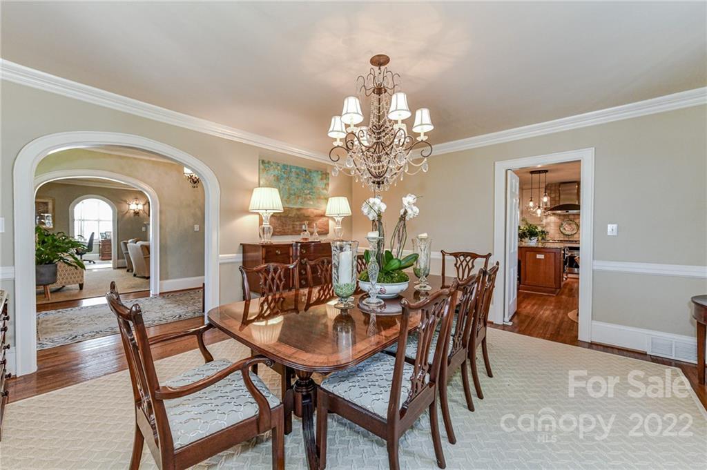 2700 Normandy Road Charlotte, NC 28209 - Photo 9 of 42 a view of a dining room with furniture and chandelier