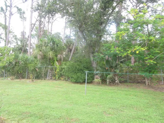 a view of outdoor space with deck and yard