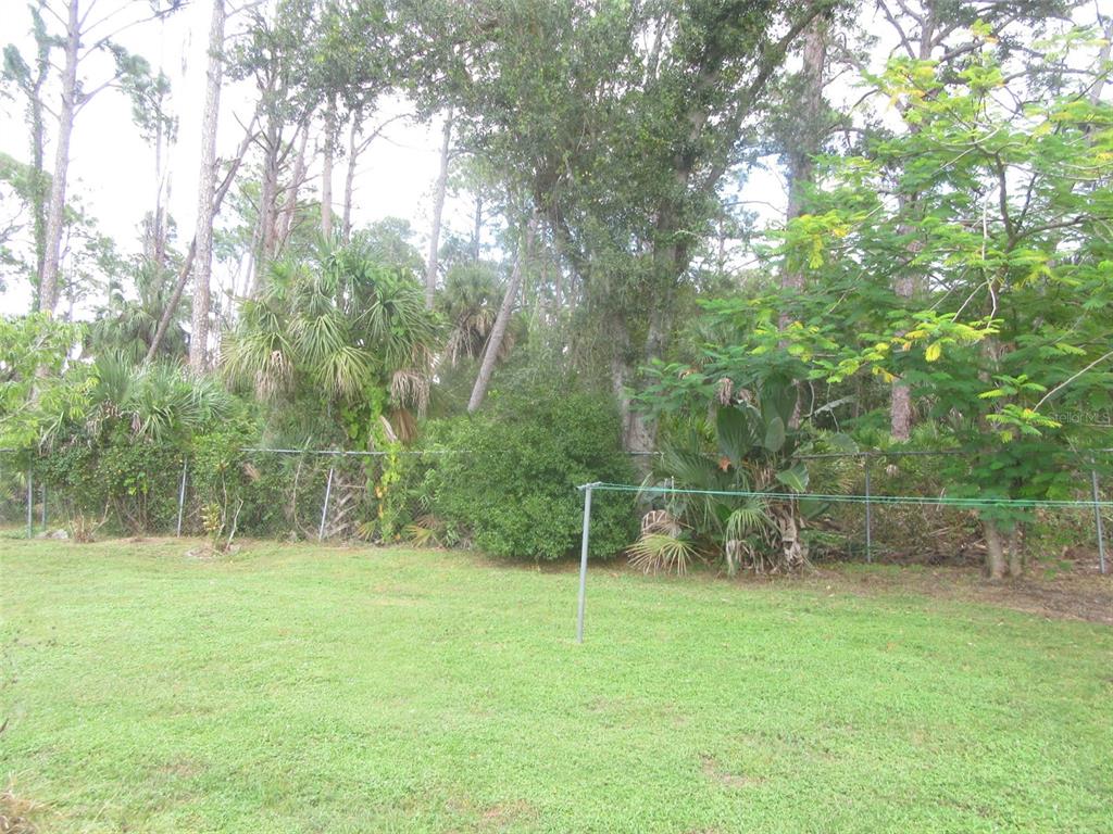 3632 Annapolis Terrace North Port, FL 34287 - Photo 14 of 14 a view of outdoor space with deck and yard