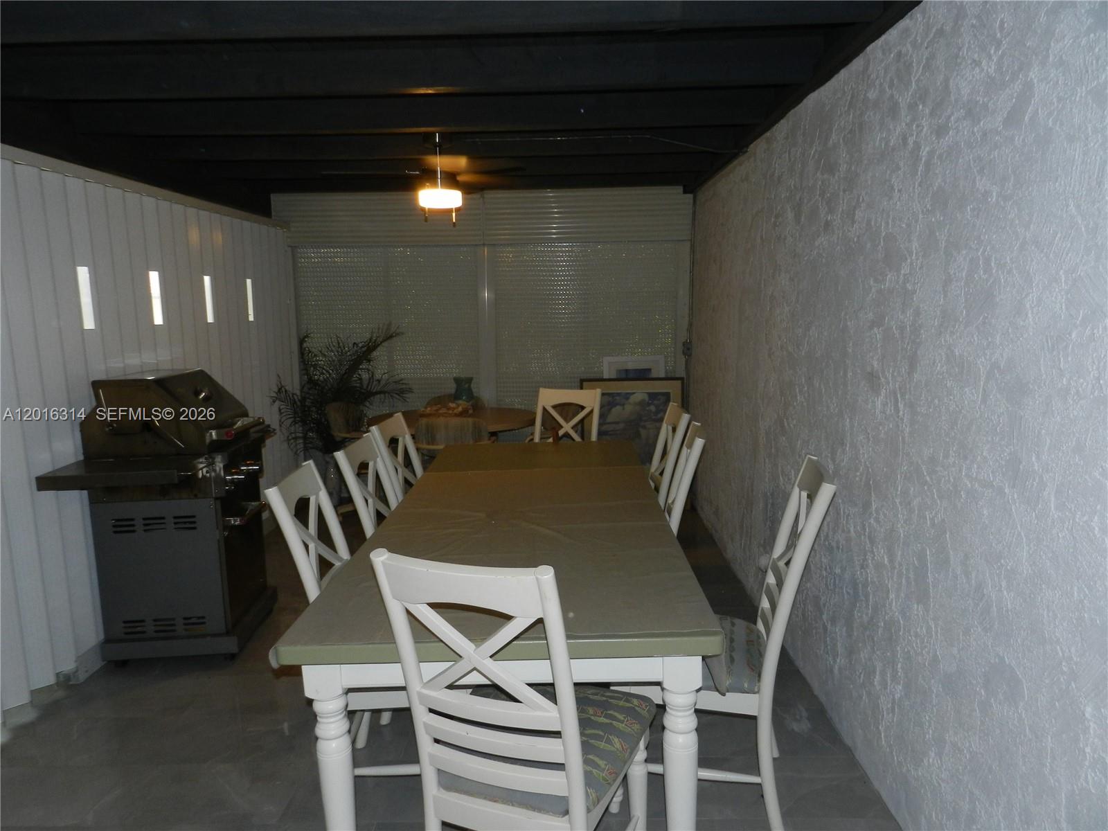 305 Northwest 42nd Street Boca Raton, FL 33431 - Photo 17 of 31 a view of a dining room with furniture