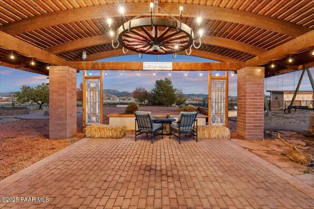 a view of a patio with a table chairs and a patio